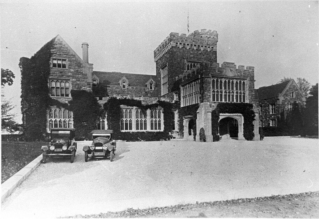 Archival photo of Hempstead House - 1920s with cars